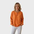 Helle | Vafli-neulepaita napilla" can be rewritten as "Helle | Button-Up Waffle Knit Sweater.